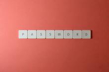 password written in scrabble tiles